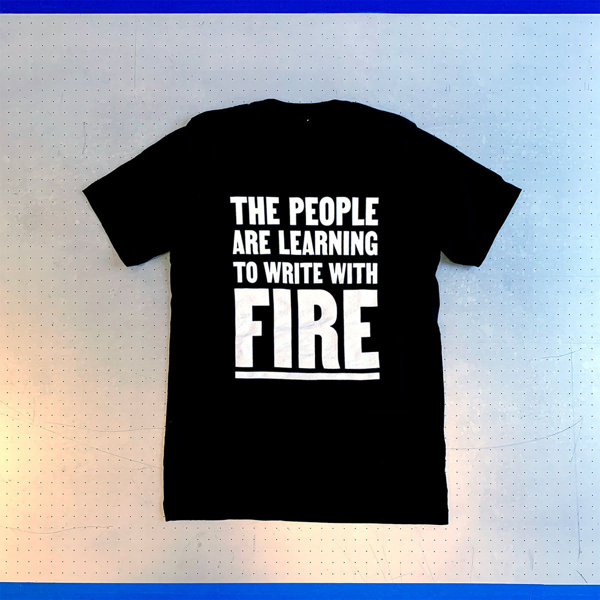 Dread Scott: The People Are Learning To Write With Fire Shirt